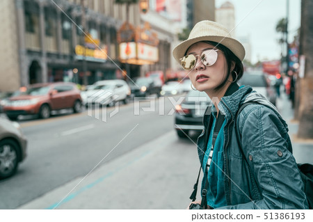 woman tourist outdoor in city waiting for cab woman tourist outdoor in city waiting for cab 51386193