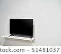 A television set with a big blank wall 51481037