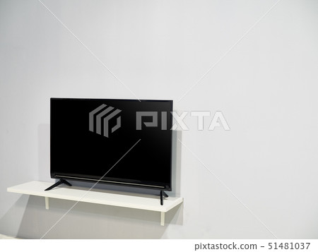 A television set with a big blank wall 51481037