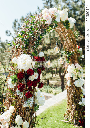 beautiful arch for the wedding ceremony in the park with white chairs for guests beautiful arch for the wedding ceremony in the park with white chairs for guests 51580194