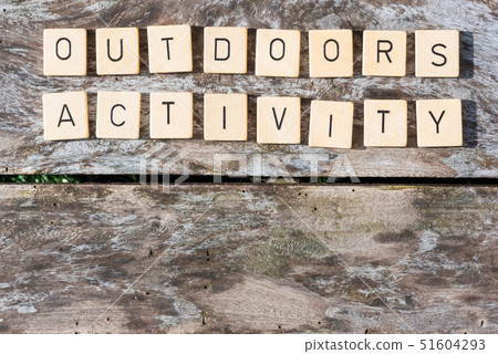 Outdoors activity words letters on a wood table Outdoors activity words letters on a wood table 51604293
