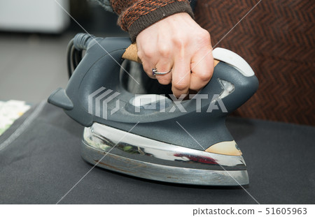 woman ironing clothe, close-up woman ironing clothe, close-up 51605963