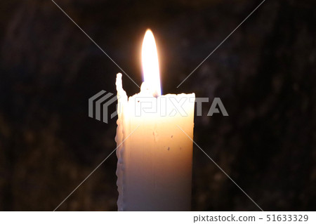 Burning candle in the Temppeliaukion Church. Burning candle in the Temppeliaukion Church. 51633329