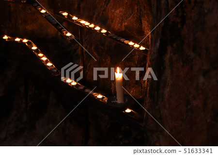 Burning candle in the Temppeliaukion Church. 51633341