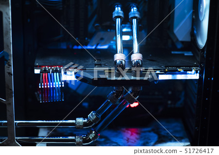 Inside a high performance computer. Computer circuit board and CPU cooling fans illuminated by Inside a high performance computer. Computer circuit board and CPU cooling fans illuminated by 51726417