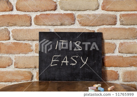 Black board with the phrase IT'S EASY drown by 51765999