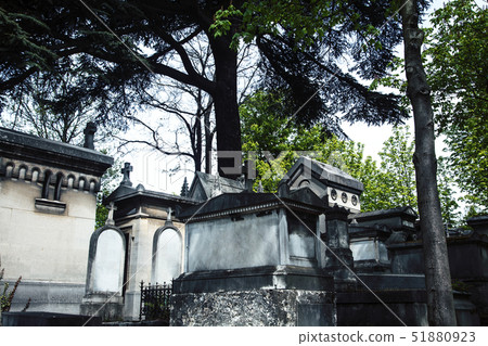 Tombstones in cemetery at dusk, gothic style crosses Paris Tombstones in cemetery at dusk, gothic style crosses Paris 51880923