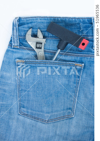 Spanner and claw hammer in rear pocket blue jeans. Spanner and claw hammer in rear pocket blue jeans. 51965536