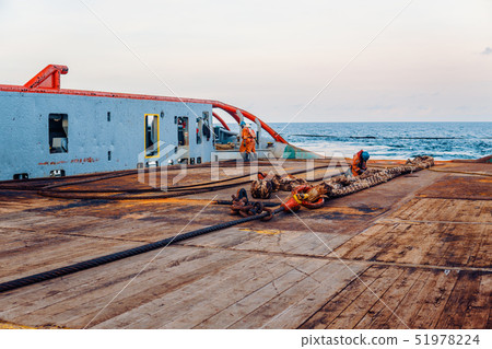 Vessel crew preparing vessel for static tow tanker lifting 51978224