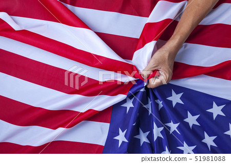 Hand asian man handful usa flag  51981088