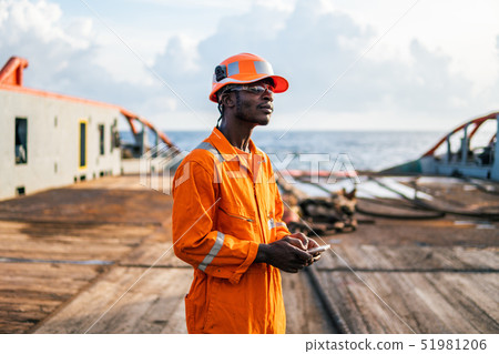 Tired Seaman AB or Bosun on deck of vessel or ship 51981206