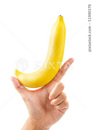 Hand holding ripe banana fruit isolated on white 51990376