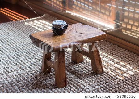 Herbal medicine containers on a wooden tea table (inside a traditional Korean house) Herbal medicine containers on a wooden tea table (inside a traditional Korean house) 52096536