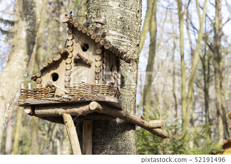 Birdhouse on a tree in the spring. Tree branch Birdhouse on a tree in the spring. Tree branch 52191496