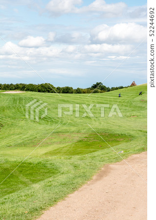 Golf course in the early summer under the blue sky Golf course in the early summer under the blue sky 52244692