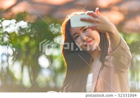 Korean women's expression, lifestyle, relaxation in park 52331084