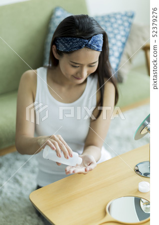 Young lady skin care 52379276