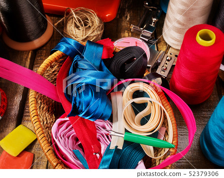Sewing accessories coil threads and bias tape in basket supplies Sewing accessories coil threads and bias tape in basket supplies 52379306