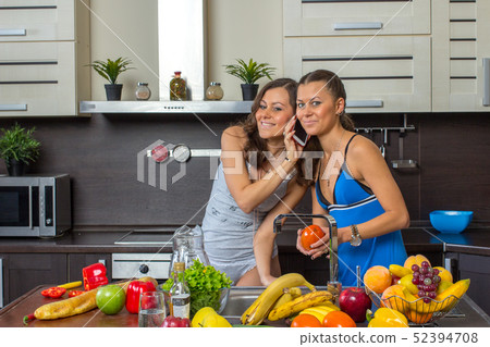 Twins on kitchen in the morning 52394708