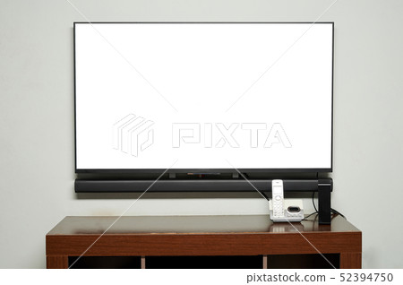 Table in living room with TV and phone 52394750