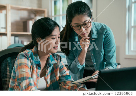 employees at desks in busy creative office employees at desks in busy creative office 52395965