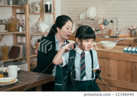 mother help daughter get ready for school mother help daughter get ready for school 52396040