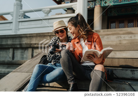 women point camera check picture having fun chat 52396108