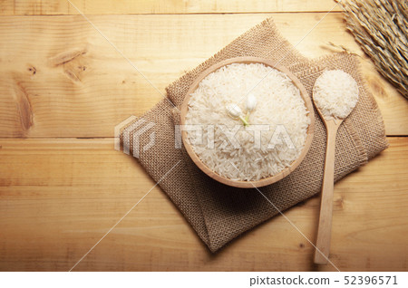 Top view of jasmine rice with jasmine flower 52396571