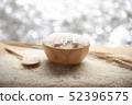 Jasmine rice in a wooden bowl with LIFE 3D text 52396575