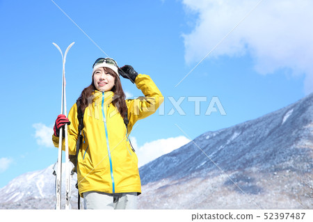 Woman enjoying winter leisure Woman enjoying winter leisure 52397487