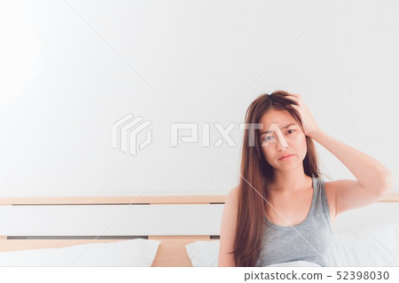 Young Asian woman feel headaches and discomfort on Young Asian woman feel headaches and discomfort on 52398030