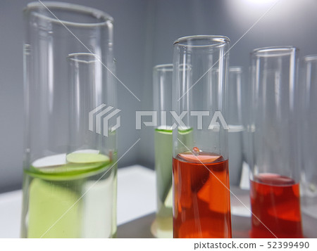 Pipettes take samples to a test tube containing ch Pipettes take samples to a test tube containing ch 52399490