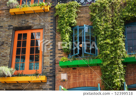 facade detail in Covent Garden with colorful houses. It contains several health food cafes and facade detail in Covent Garden with colorful houses. It contains several health food cafes and 52399518