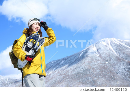Woman enjoying winter leisure 52400130