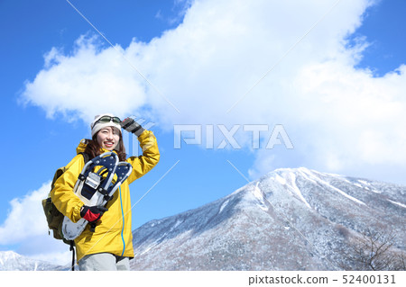 Woman enjoying winter leisure Woman enjoying winter leisure 52400131