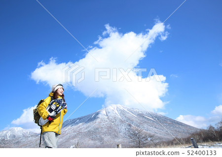 Woman enjoying winter leisure Woman enjoying winter leisure 52400133