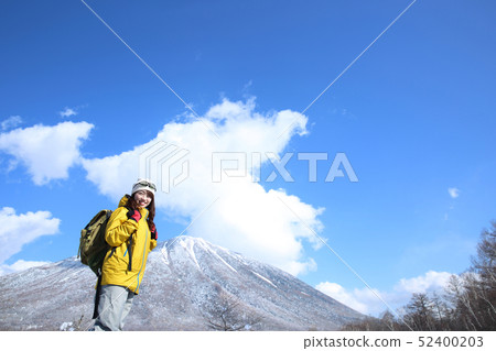 Woman enjoying winter leisure 52400203