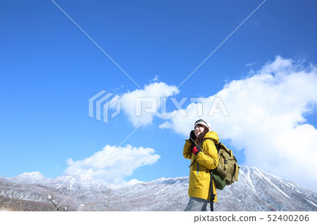 Woman enjoying winter leisure Woman enjoying winter leisure 52400206