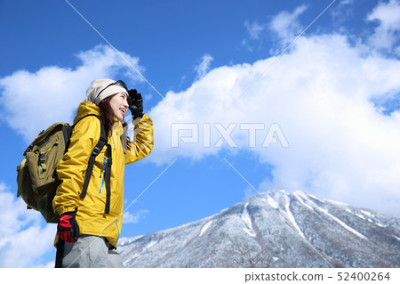 Woman enjoying winter leisure Woman enjoying winter leisure 52400264