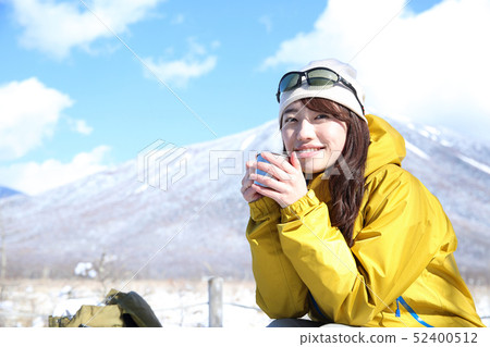 Woman enjoying winter leisure 52400512