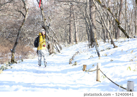 Woman enjoying winter leisure Woman enjoying winter leisure 52400641