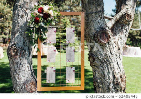 Original vintage wooden board with guest list 52408445