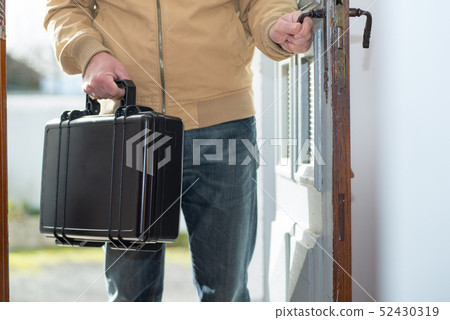 man with a black suitcase going home man with a black suitcase going home 52430319