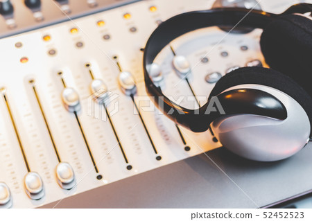 headphone on mixing console. music concept headphone on mixing console. music concept 52452523