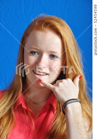 Teen miming a phone with her hand 52454599