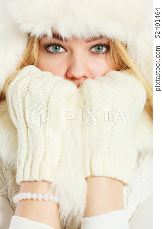 Blonde woman with fur cap. 52491464