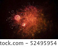 Bright salute in the black sky. Fireworks against the dark sky. 52495954