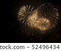 Bright salute in the black sky. Fireworks against the dark sky. 52496434