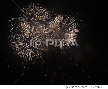 Fireworks against the dark sky. Bright salute in the black sky, 52496498
