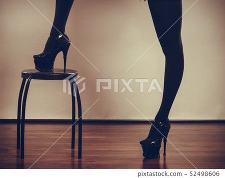 Sexy long female legs in black. 52498606